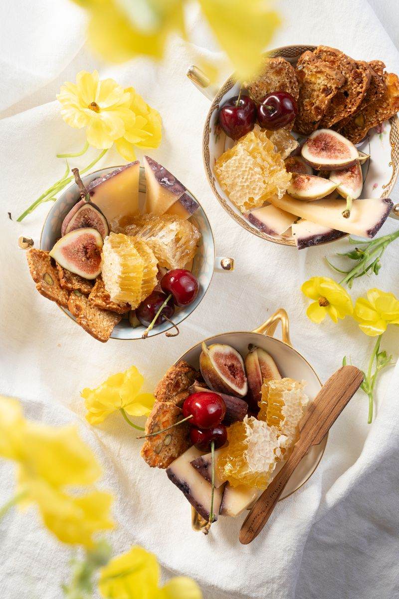 Charcuterie cups with figs and honeycomb.